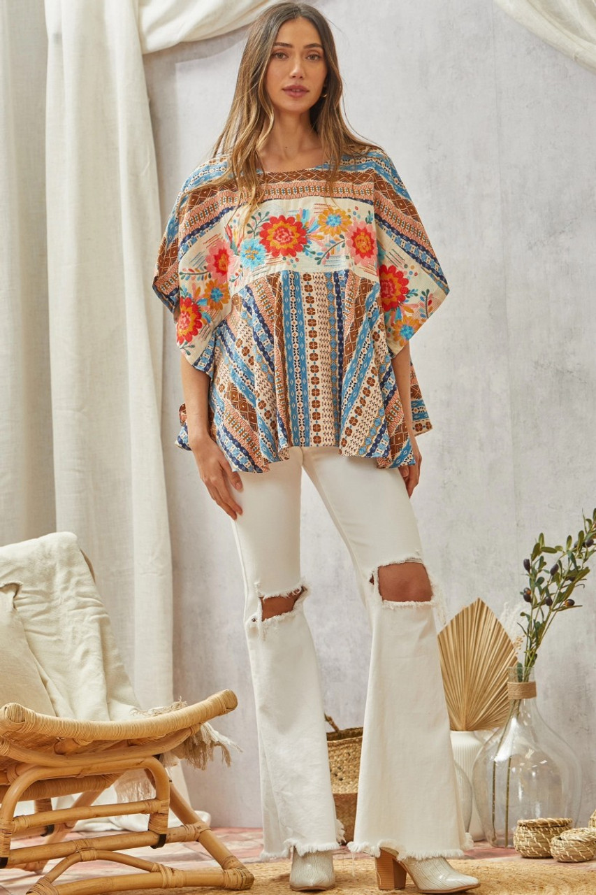 https://cdn11.bigcommerce.com/s-mkx5msl2io/images/stencil/1280x1280/products/16189/80117/FLORAL-PRINTED-PONCHO-LADIES-SHIRT-SHIRT-18468-3__S_3__47977.1708050154.jpg?c=1&imbypass=on