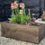 A wooden flower planter stained using Timber Eco Shield - Weathered Wood