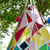 Multi-coloured wooden children's garden teepee with sections painted in Wood Stain + Protect - Baby Pink