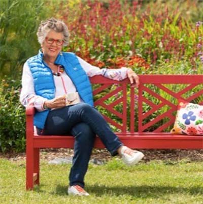 Prue Leith sat on a bench painted in Protek Royal Exterior