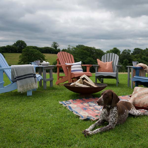 Outside chairs pained in our wood stains and paints