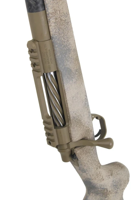 SOLD! Carbon Rifleman in 7 PRC, showcasing a tan and black rifle stock with bolt action mechanism and a camouflage pattern, suitable for hunting or tactical use.