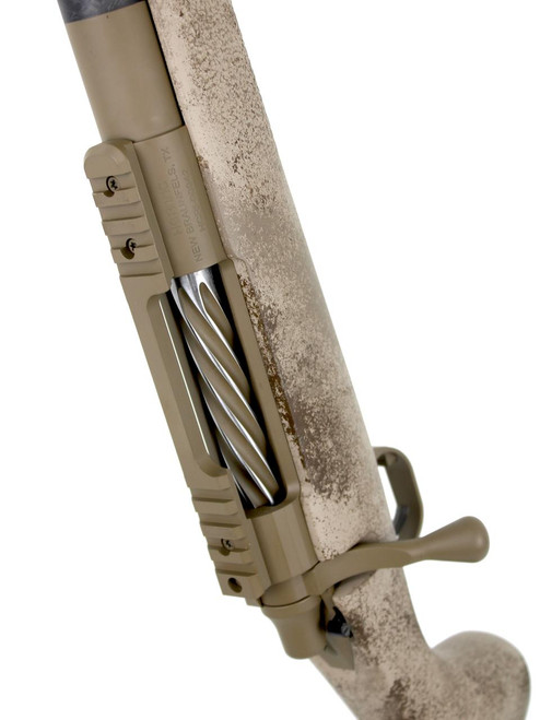 SOLD! Carbon Rifleman in 7 PRC, close-up view of the rifle's bolt and action in desert tan finish with weathered stock.