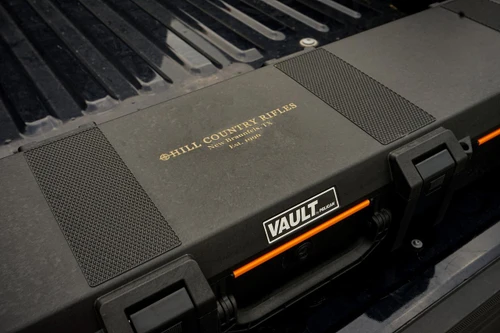V770 Vault Custom Cut Rifleman Case, a custom foam interior gun storage case with the label 'Hill Country Rifles' and 'Vault by Pelican' branding.