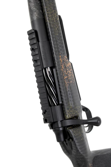 SOLD! Carbon Hunter in 6.5 Creedmoor, close-up of the rifle's scope mount and barrel showing a camouflage pattern and textured design.