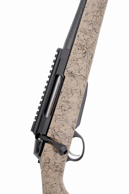 Tikka T3x Lite Harvester in 22-250, close-up view of the rifle showing the camo-patterned stock with black and grey accents, bolt action mechanism, and mounting rail for optics.
