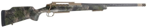 Carbon Rifleman in 7mm PRC - 20" Woodland Mirage, side view of a bolt-action rifle with a woodland camouflage stock, tan receiver, carbon-fiber barrel, and muzzle brake on a white background.