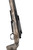 Pathfinder in 7mm PRC, close-up image of a precision rifle with a weathered camouflage stock and a mounted scope.