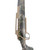 Carbon Rifleman in 7mm PRC - 20" Woodland Mirage, close-up of the bolt-action rifle receiver, fluted bolt, tan metal components, and woodland camouflage stock on a white background.