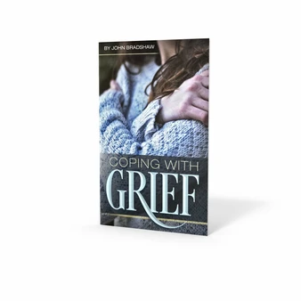 Front cover of the pocketbook "Coping with Grief" by John Bradshaw, featuring a soft, comforting design with a peaceful nature scene to symbolize hope and healing.