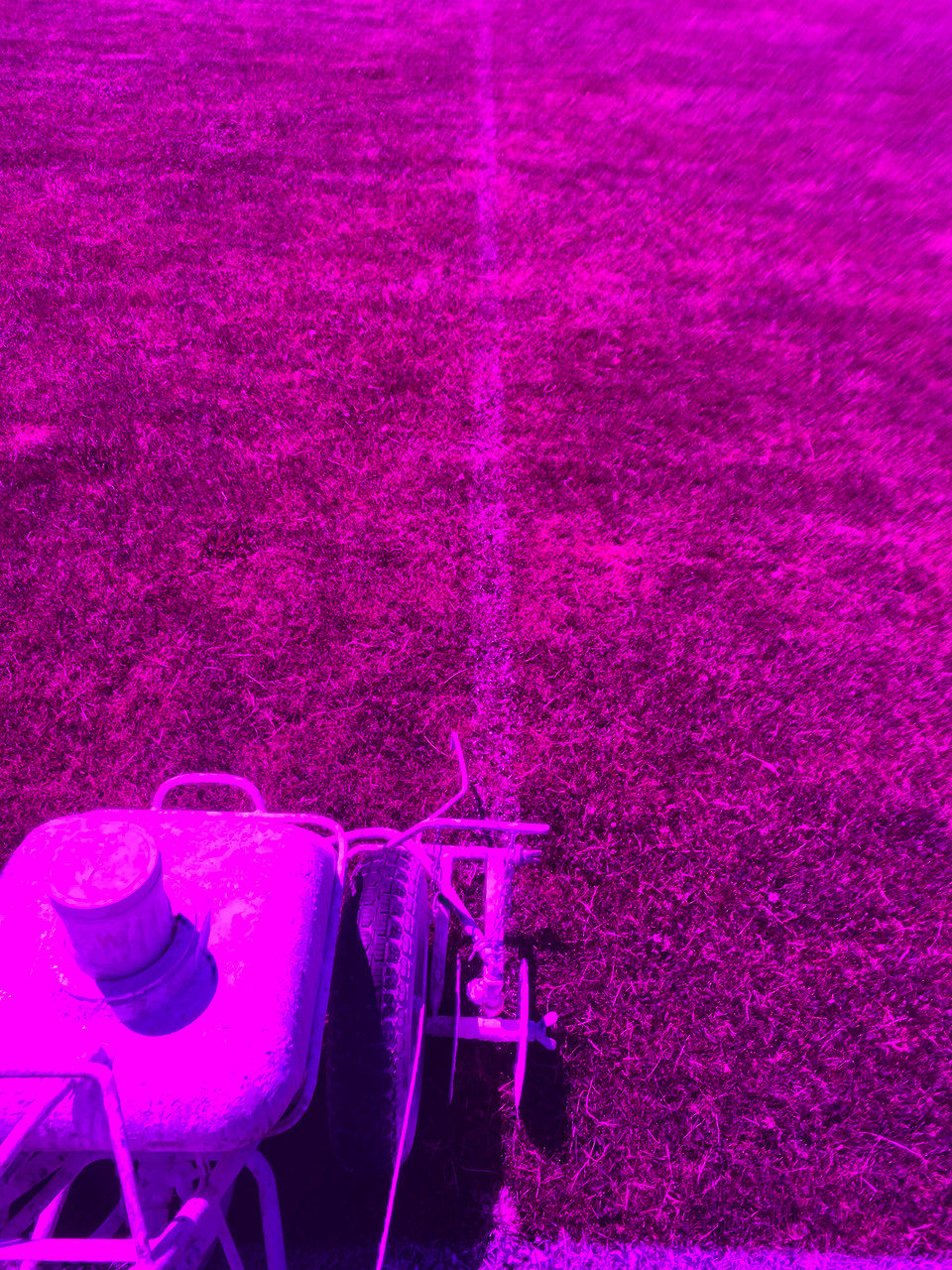 Instead of pulling a string, use the Turf Stress Detection Glasses to easily see the paint lines to repaint the athletic Field. This is a view through the Turf Stress Detection Glasses