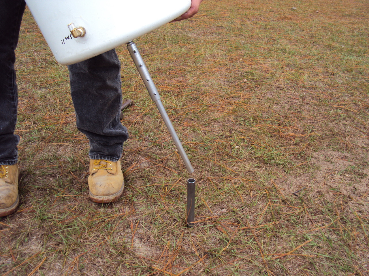 Turf-Tec International Large Volume Mariotte Tubes for use with 12 and 24 Inch Diameters Infiltration Rings for ASTM 3385 - Showing spike insertion into previously driven pipe