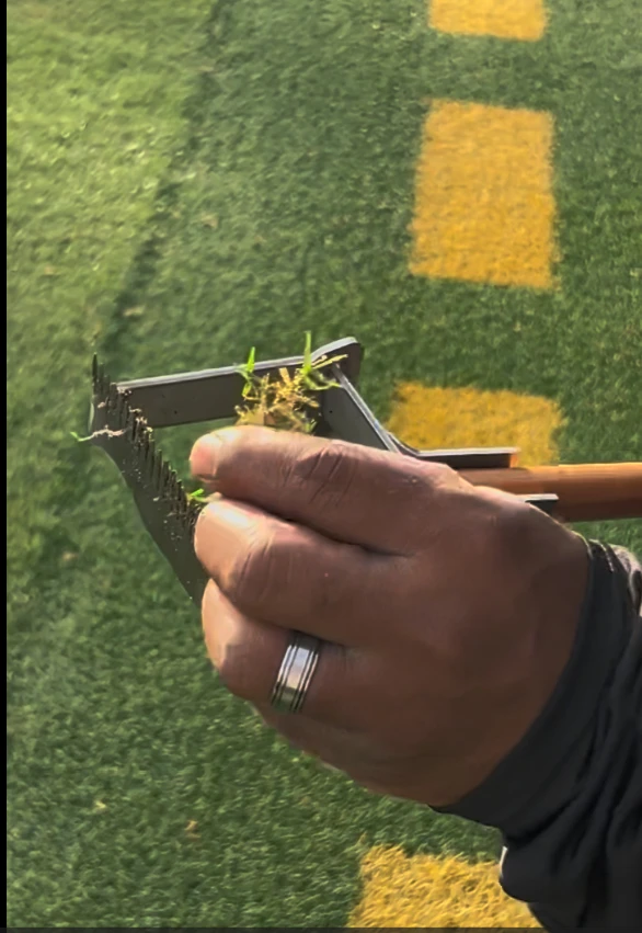 The Turf-Tec Synthetic Turf Comb is a professional maintenance tool designed to remove unwanted natural grass growing within synthetic turf systems