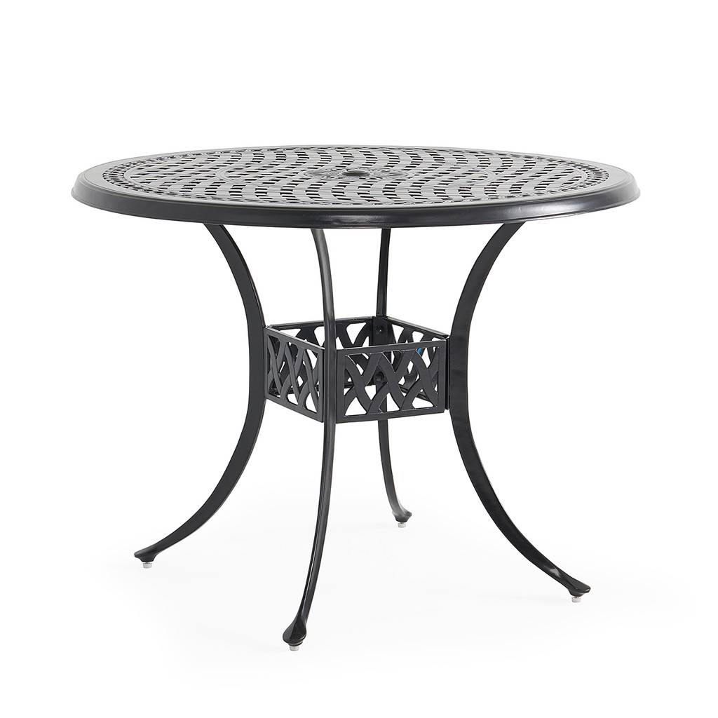 Close view of the round patio table showing lattice top and curved legs