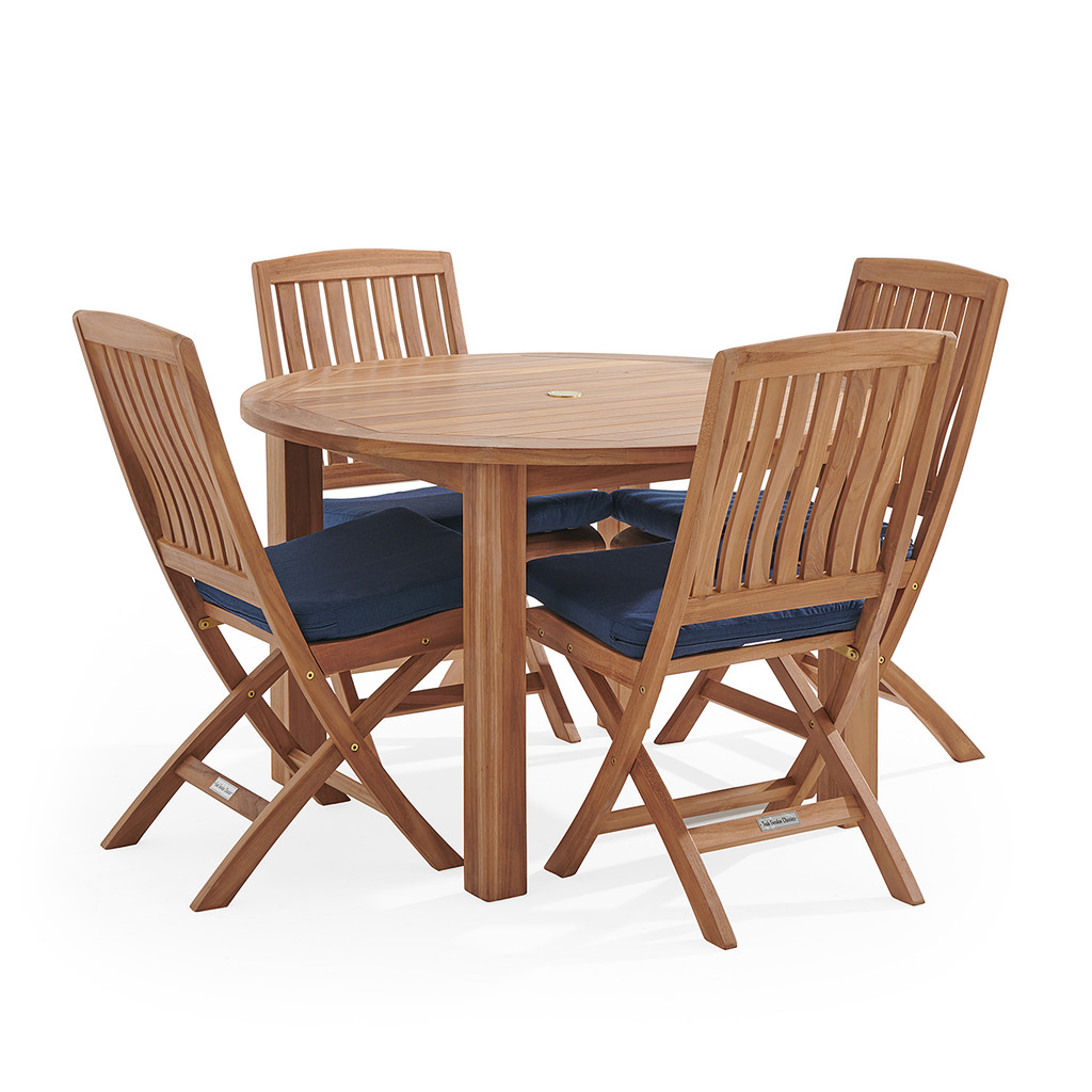 Teak round table with six chairs and navy cushions