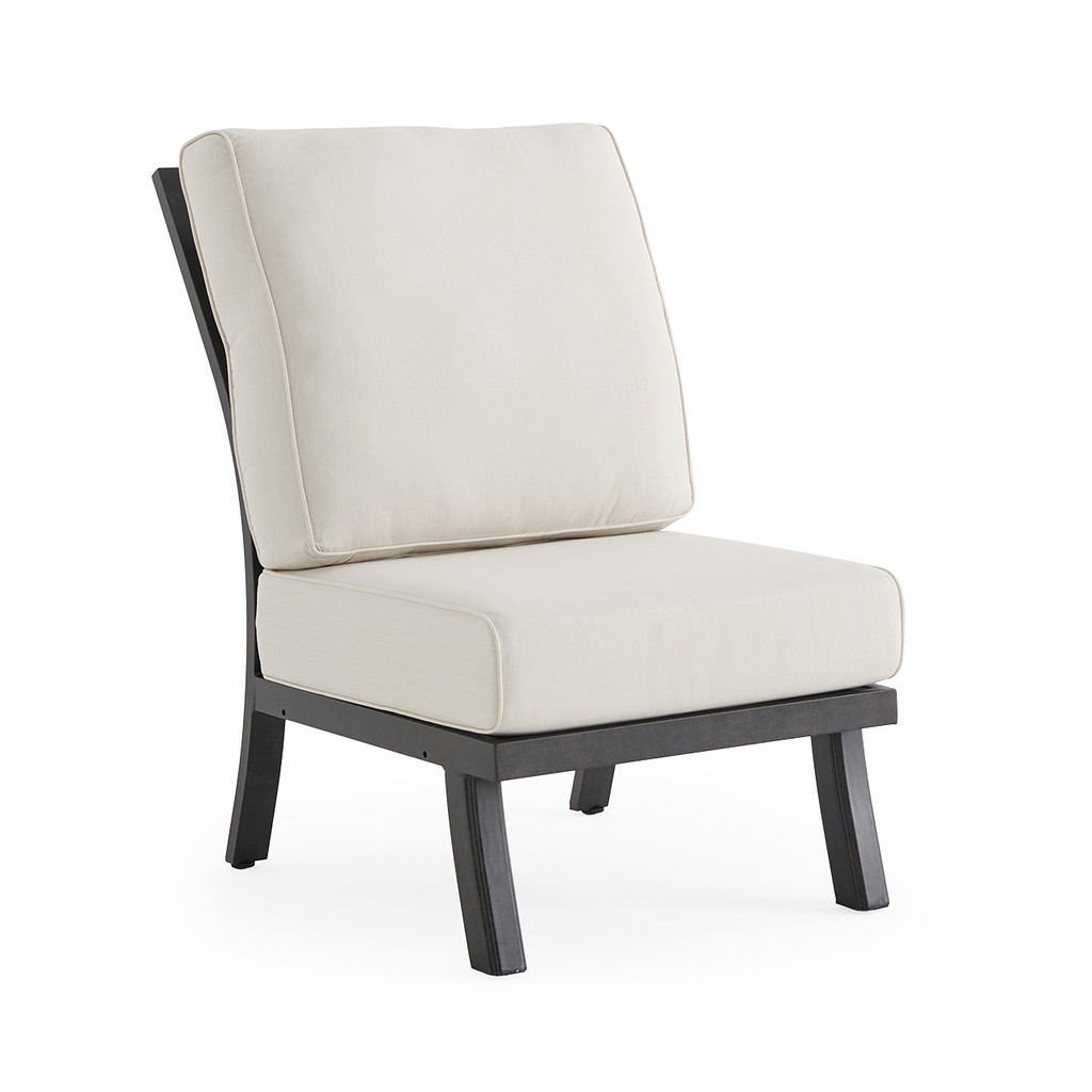 Side/back view of cream cushion chair with dark frame.