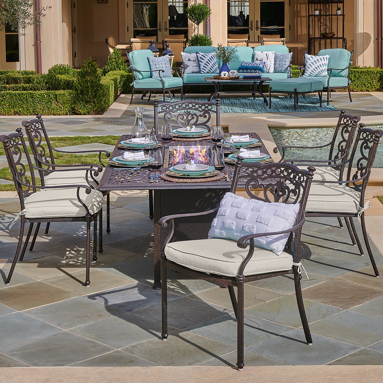 Milan Aged Bronze Cast Aluminum with Cushions 7 Piece Dining Set + 84 x 44 in. Fire Pit Table