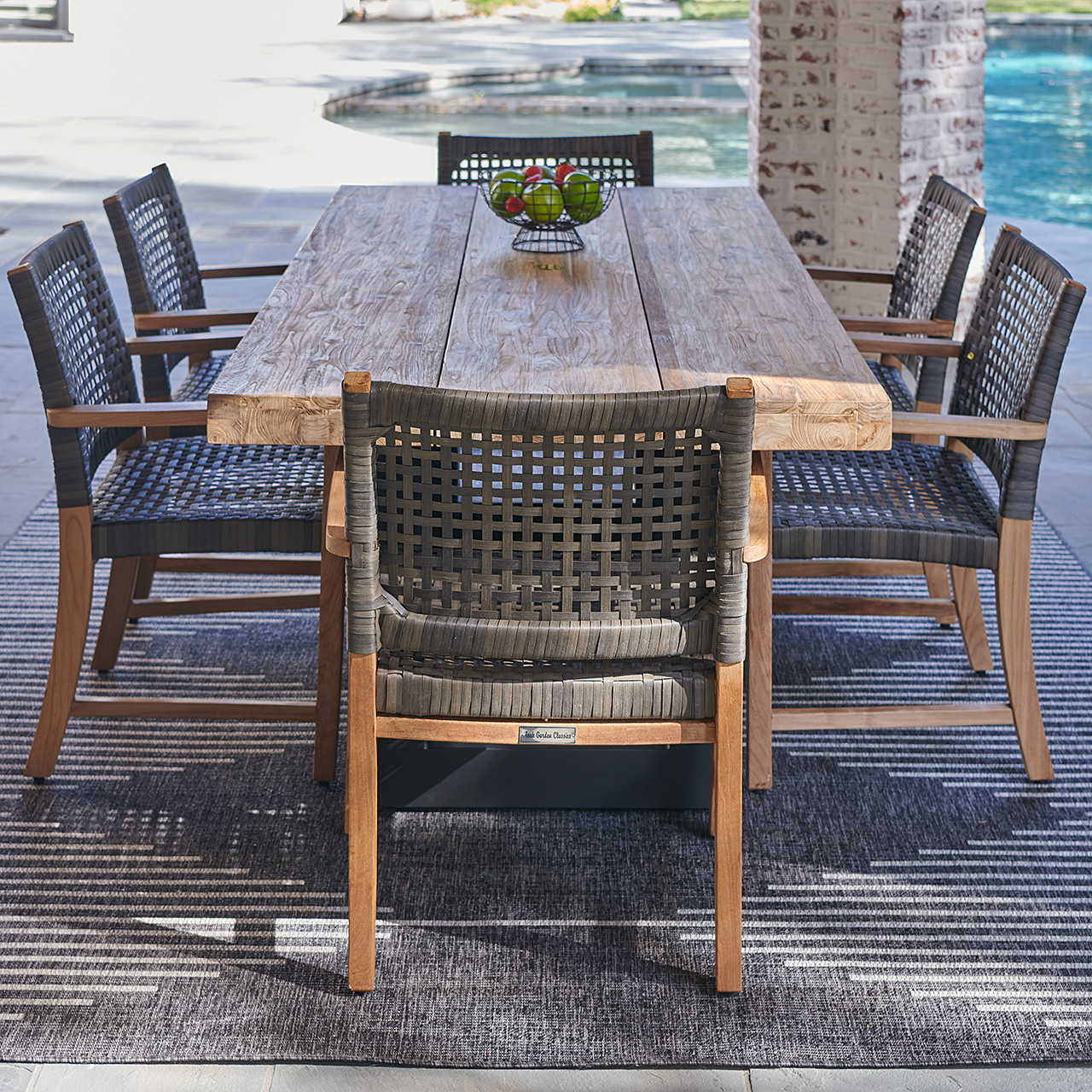 Hampton Driftwood Outdoor Wicker and Solid Teak 7 Piece Arm Dining Set with 87 x 40 in. Table