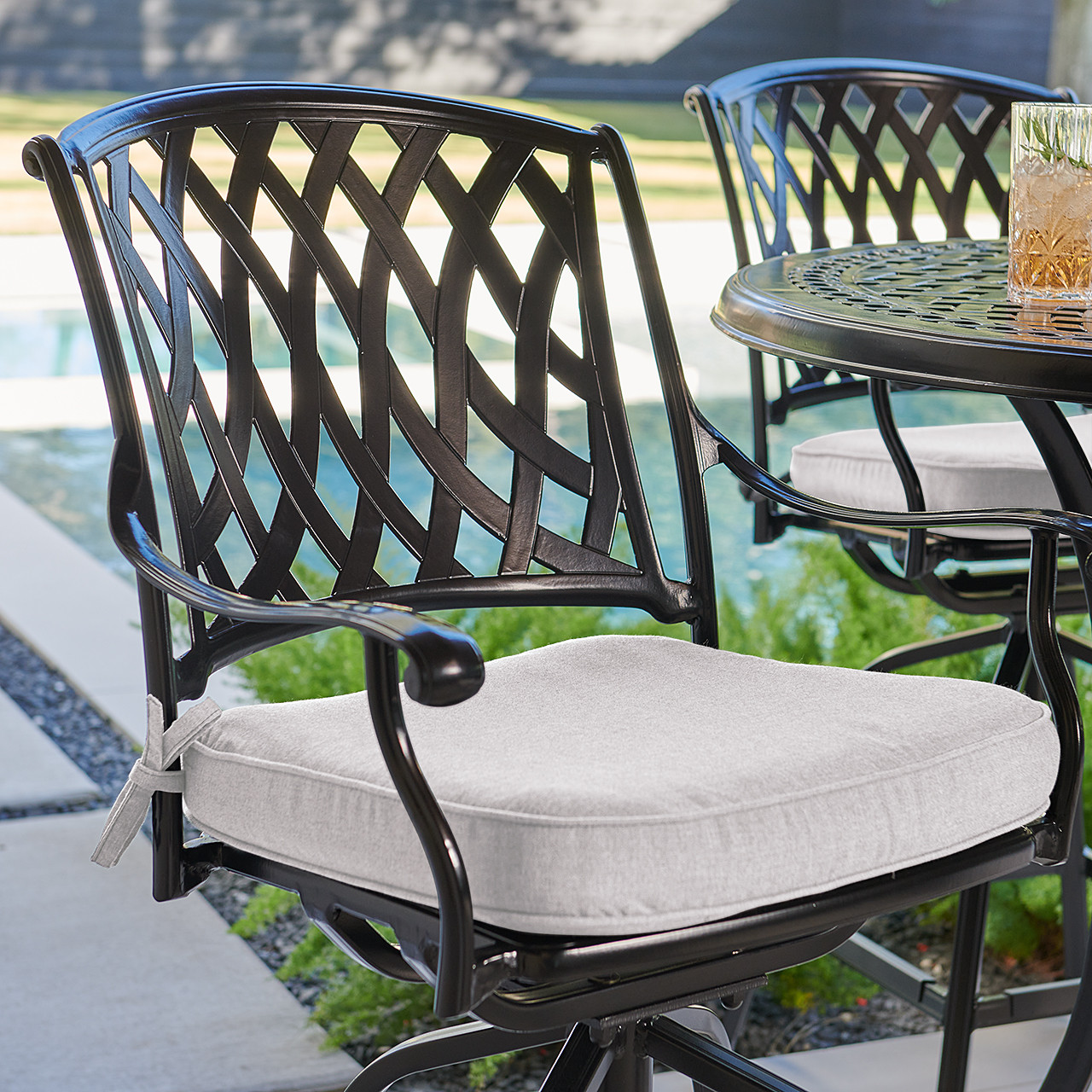 Tivoli Matte Black Cast Aluminum with Cushions 5 Piece Swivel Bar Set + 48 in. D Table Tivoli Matte Black Cast Aluminum with Cushions 5 Piece Swivel Bar Set + 48 in. D Table