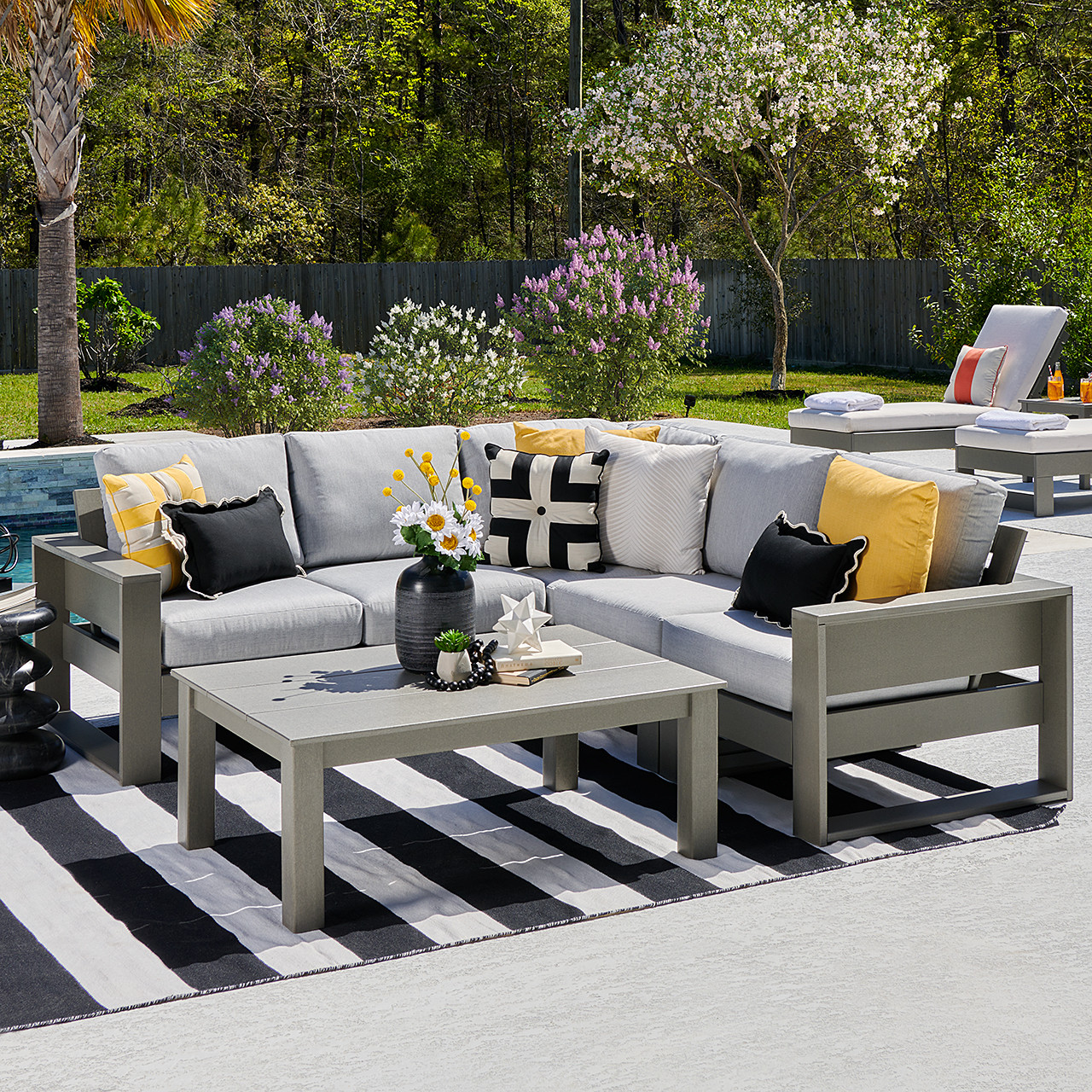 Montauk Polymer with Cushions 6 Piece Modular Sectional + 48 x 32 in. Coffee Table