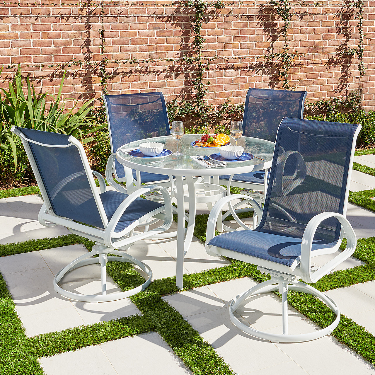 Outdoor glass top 2025 table and chairs