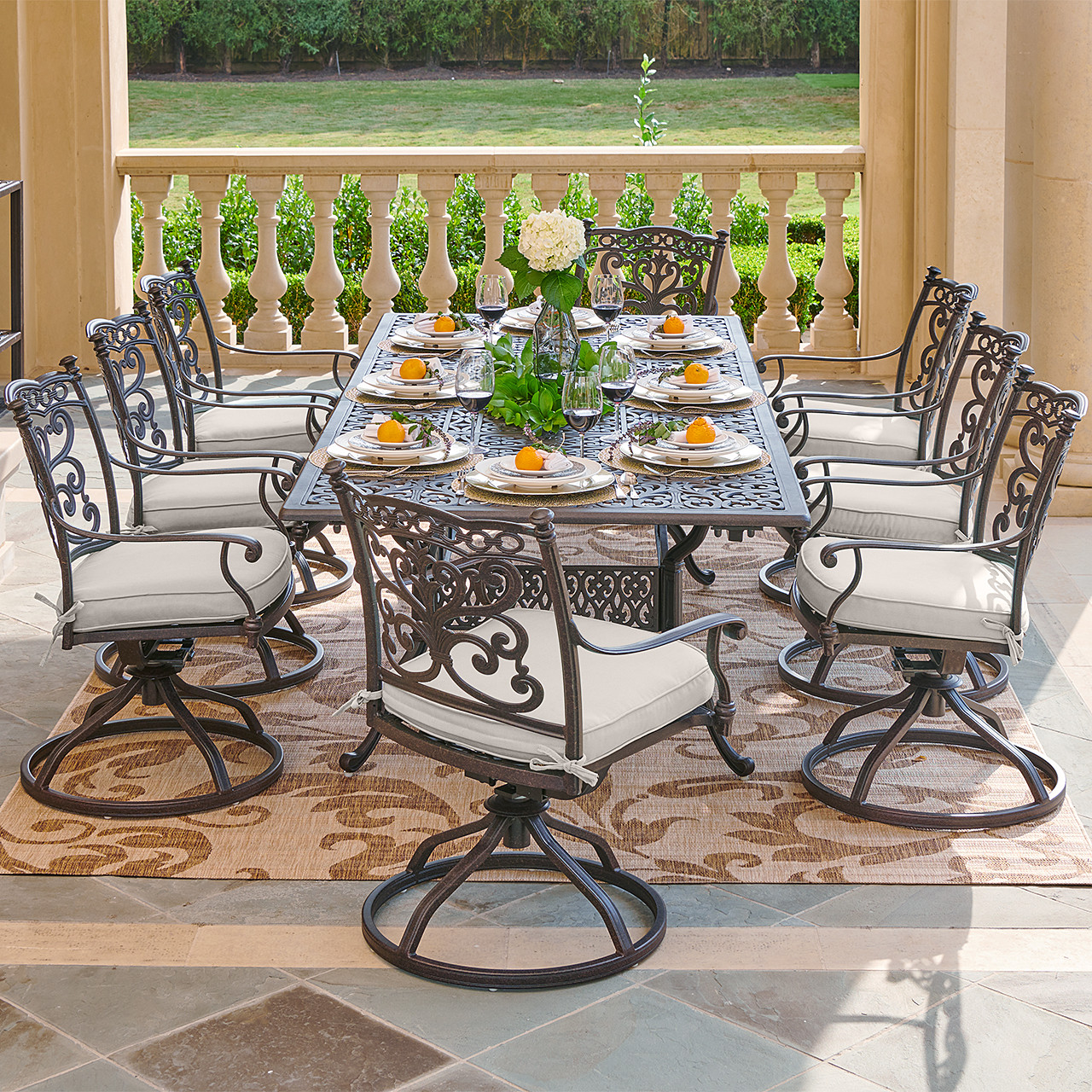 Milan Aged Bronze Cast Aluminum with Cushions 9 Piece Swivel Rocker Dining  Set + 71-103 x 44 in. Extension Table