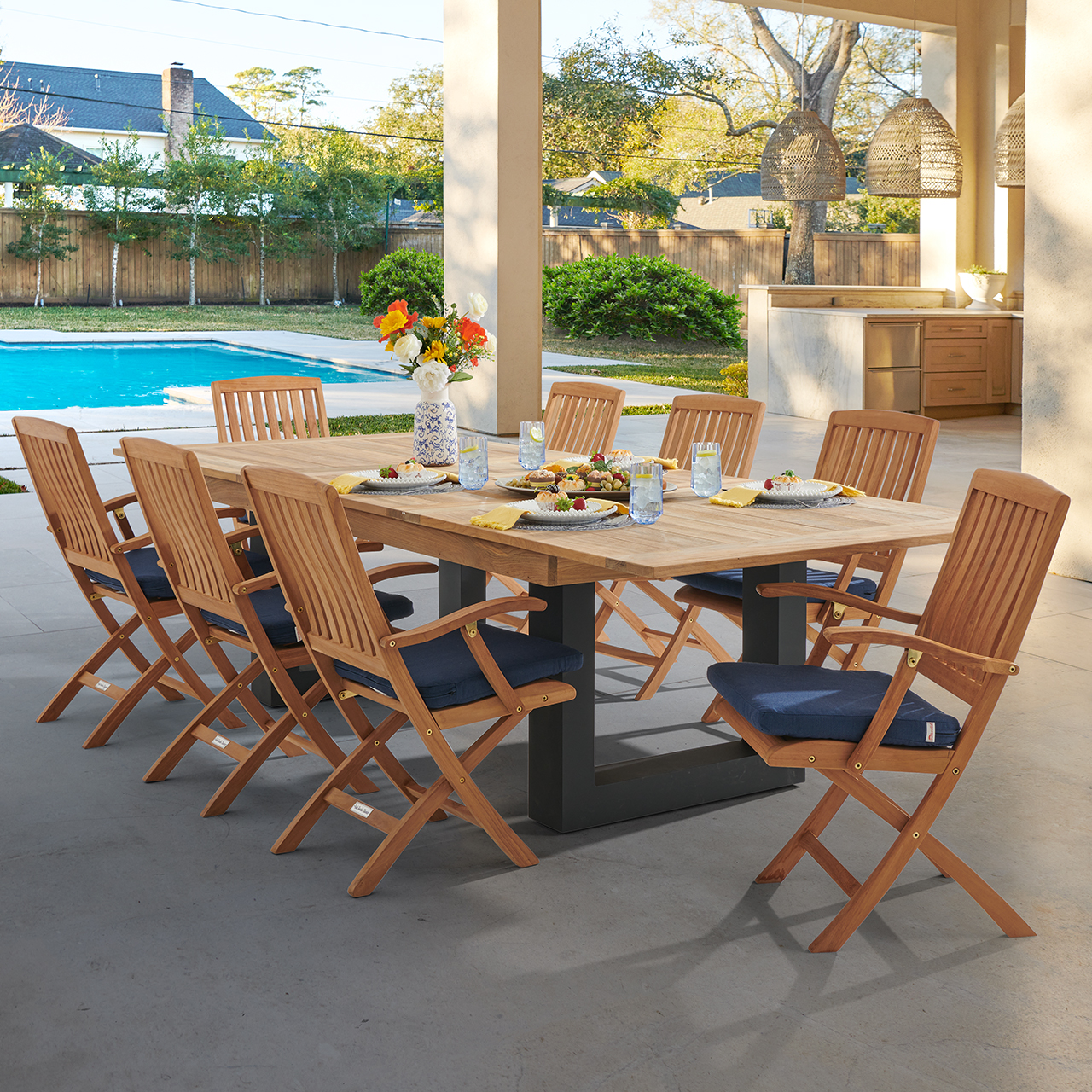 Westport Teak with Cushions 9 Piece Arm Dining Set + Balencia 87-118 x 47 in. Double Extension Table (Spectrum Indigo)