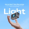 Creality Pika portable 3D scanner weighing 260 g and balanced above a hand