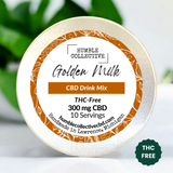 Humble Collective Golden Milk CBD Drink Mix – 300 mg THC-Free CBD per tin, 10-serving turmeric-based wellness blend, packaged with golden orange floral label, handmade in Lawrence, Michigan, displayed with leafy green background.