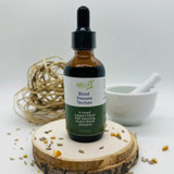 Abeca Naturals Blood Pressure Tincture 2 oz bottle, an herbal blend with lemon balm and yarrow, displayed on a wooden slice with natural decor in the background