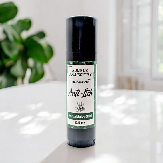 Humble Collective Anti-Itch Herbal Salve Stick – 0.5 oz natural CBD-free remedy for bug bites, rashes, and skin irritation, in a twist-up tube with green botanical label, displayed on a white surface with soft daylight and plant background. Humble Collective Anti-Itch Herbal Salve Stick – 0.5 oz natural CBD-free remedy for bug bites, rashes, and skin irritation, in a twist-up tube with green botanical label, displayed on a white surface with soft daylight and plant background.