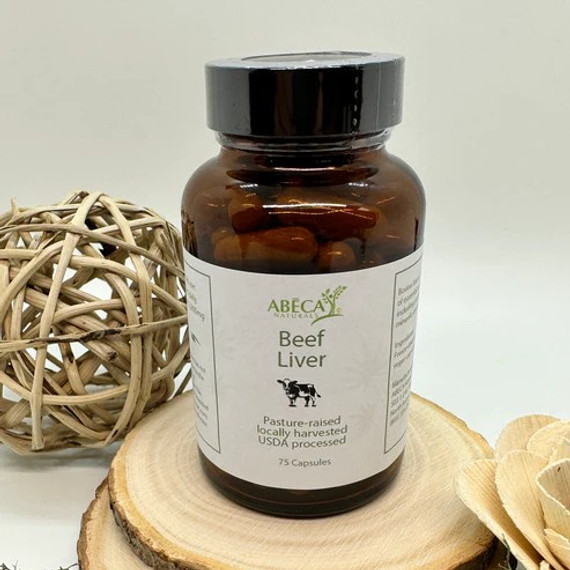 Abeca Naturals Beef Liver Capsules 75-count bottle, made from pasture-raised, locally harvested, USDA processed cattle, displayed on a wooden slice with natural decor in the background. Abeca Naturals Beef Liver Capsules 75-count bottle, made from pasture-raised, locally harvested, USDA processed cattle, displayed on a wooden slice with natural decor in the background.