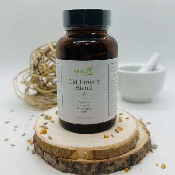 Abeca Naturals Old Timer’s Blend 100-count capsule bottle, herbal memory and cognitive support supplement for the aging brain, displayed on a wooden slice with lavender buds, citrus peel, and natural decor Abeca Naturals Old Timer’s Blend 100-count capsule bottle, herbal memory and cognitive support supplement for the aging brain, displayed on a wooden slice with lavender buds, citrus peel, and natural decor