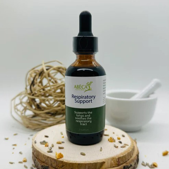 Abeca Naturals Respiratory Support 2 oz tincture bottle, herbal blend with caraway, mullein, and marshmallow for lung and respiratory wellness, displayed on a wooden slice with lavender buds, citrus peel, and natural decor. Abeca Naturals Respiratory Support 2 oz tincture bottle, herbal blend with caraway, mullein, and marshmallow for lung and respiratory wellness, displayed on a wooden slice with lavender buds, citrus peel, and natural decor.
