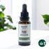 1 oz amber glass dropper bottle labeled “Humble Alternative PURE Tincture” containing 350 mg THC and 350 mg THCA, placed on a white surface with green plants in the background and a cannabis warning icon in the corner.