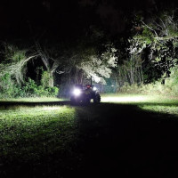 Honda ATV break light and reverse light from Vessel Power Sports powder coated black installed on a ATV showing how bright it is