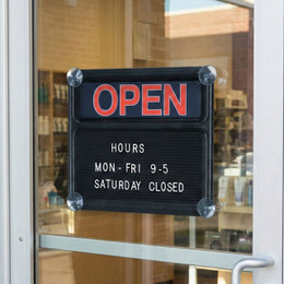 Open/Closed Sign Hung in Window