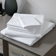 LodgMate 144 ct. White Flat Sheets - Twin 66"x104"