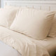 Thomaston Bone Sheets & Pillowcases on Bed