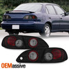 Fits 1998-2002 Toyota Corolla CE VE S Black Smoked Altezza Tail Lights Set LH+RH