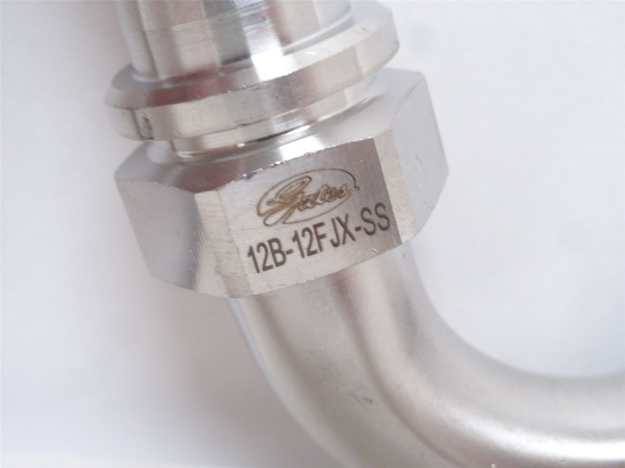 Gates 12B-12FJX90M-SS; Tube Elbow SS 90Deg 3/4JIC x 3/4 Barb