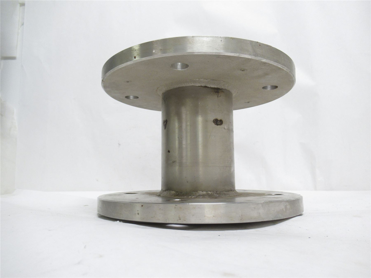 MFG- MDL-UNKN-236614; Spool/Flange SS; 10-1/2"OD x 7-1/8" Wide