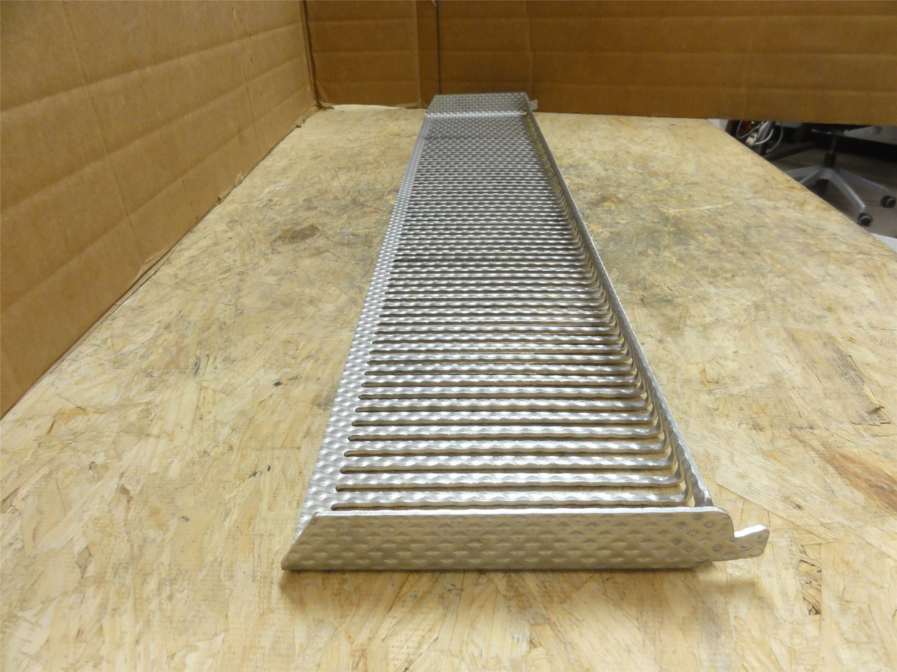 MFG- 1250035500; Slotted SS Long Chute; 39" Long x 7-1/8" Wide