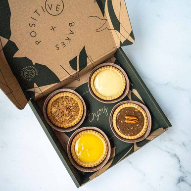 Thank You Luxury Tart Selection Box | Vegan, Gluten Free, Dairy Free, Eggless Feast your eyes on our all-NEW vegan and gluten free tart selection box! Packed with crunch, creaminess, tangy lemon and exotic passion fruit, these luxury tarts are perfect as a treat to yourself or as a gift to a loved one. Contains 4 tarts in different flavours and a Thank you sleeve. Don’t forget to include a FREE personalised message if you’re buying this mouth-watering box as a gift! Have a look below to see what you’ll get in this delicious box. Apple Tart - A deliciously crumbly homemade
