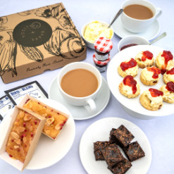 Good Luck Afternoon Tea Treat Box | Serves 1-2 | Vegan, Gluten Free, Dairy Free, Eggless Your Very Own Afternoon Tea Delivery Looking for the perfect sweet treats for your vegan and gluten free afternoon tea for up to two people? Look no further! We've put together an afternoon tea set - available for delivery - containing a selection of delicious vegan and gluten-free bakes, so you can create the perfect afternoon tea experience at home the perfect good luck gift box with sleeve. This afternoon tea gift box includes 4 mini scones (you can choose either classic or fruit), 2 mini egg