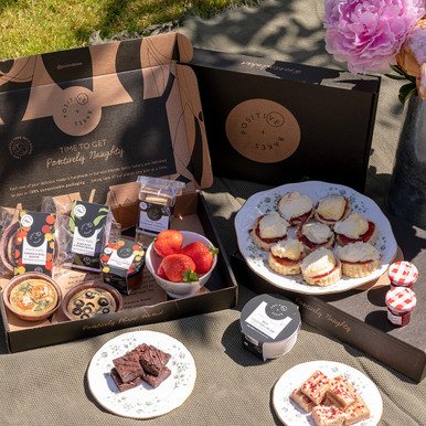 Sweet & Savoury Afternoon Tea Picnic Hamper | Serves 2-4 | Vegan, Gluten Free, Dairy Free, Eggless Treat yourself to our delicious sweet and savoury afternoon tea picnic hamper for up to 4 people! This box is perfect for a relaxed afternoon tea at home with friends and family, and contains a selection of our new savoury quiches, pâtés, crackers, scones, vegan clotted cream, blondie bites, brownie bites and more! Premium afternoon tea without ever having to leave the house! If you’re buying this box as a gift, don’t forget to add a FREE gift message at the checkout. Have a look below to see mo