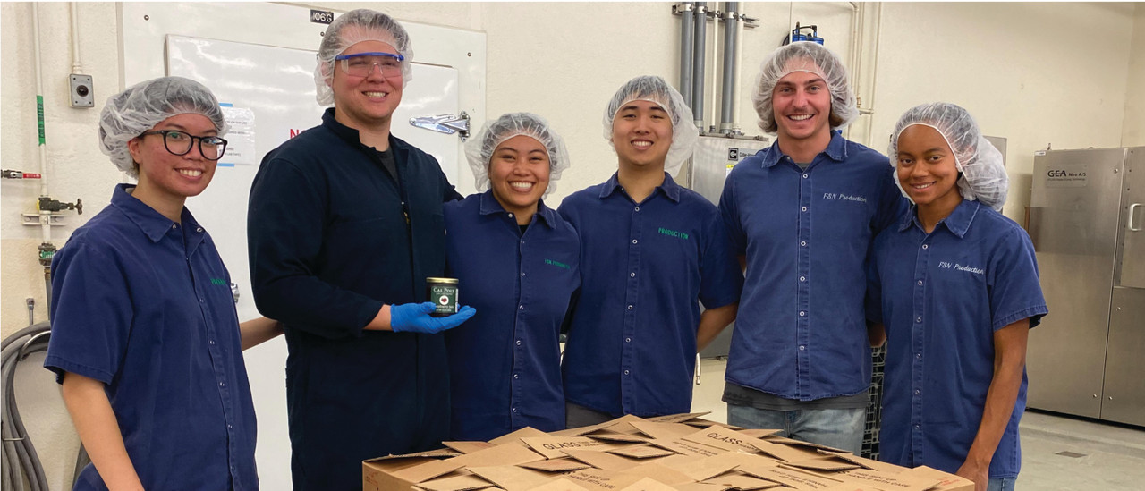 Cal Poly student employees proudly show cases of jam