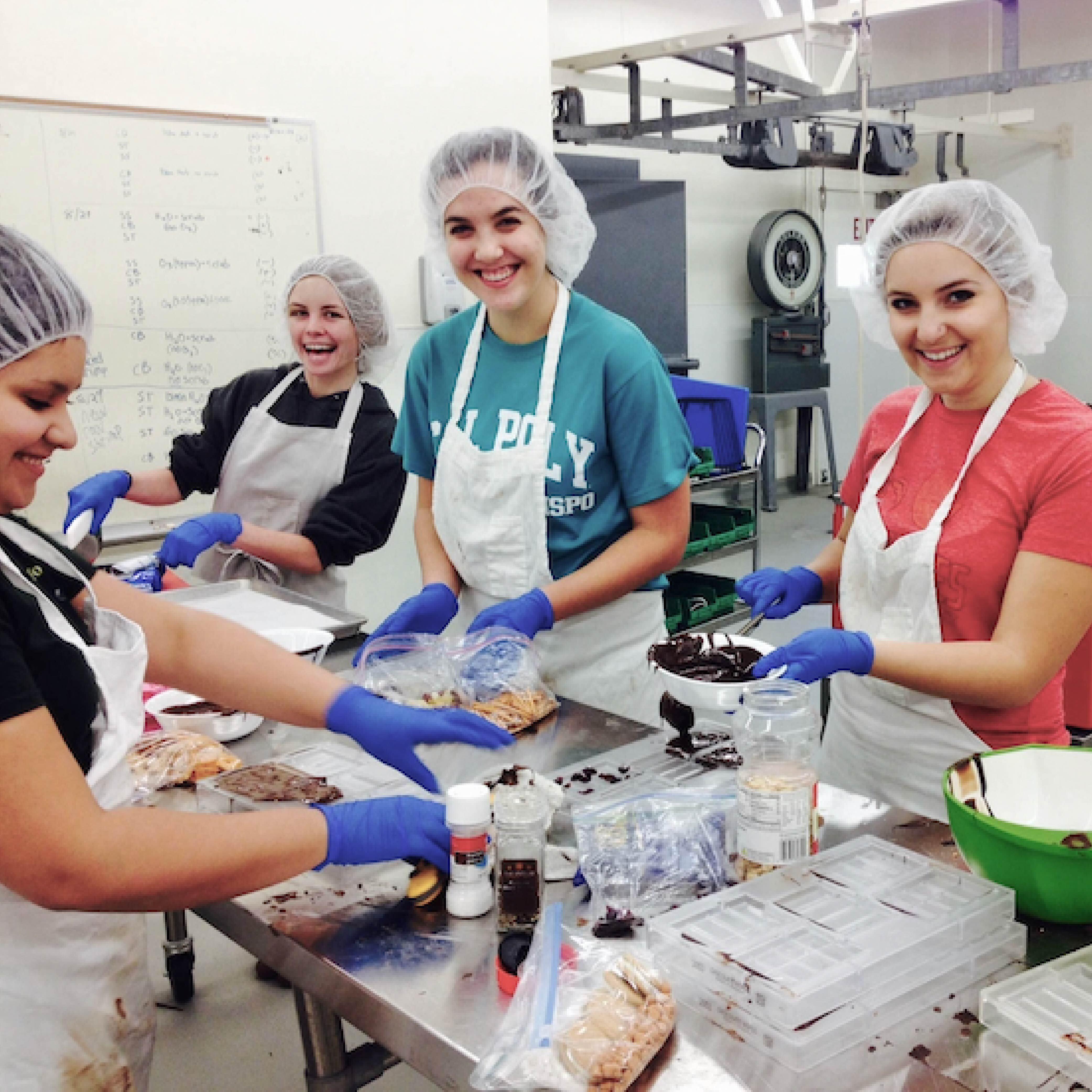 Cal Poly student employees working in the Food Science and Nutrition pilot plant