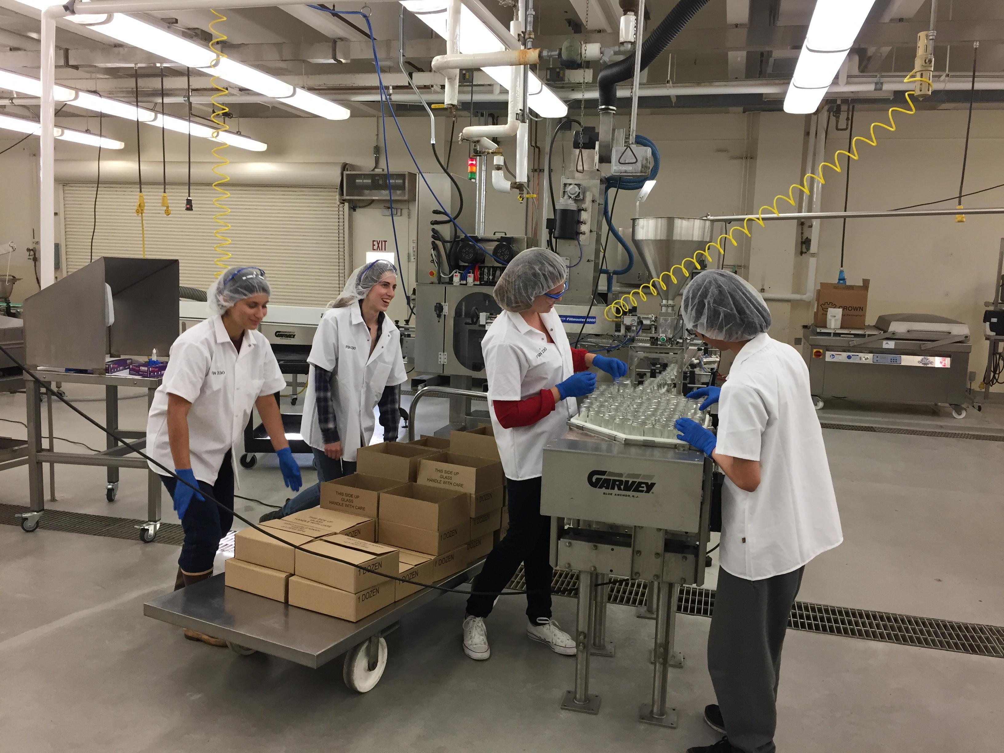 Cal Poly student employees working in the Food Science and Nutrition pilot plant