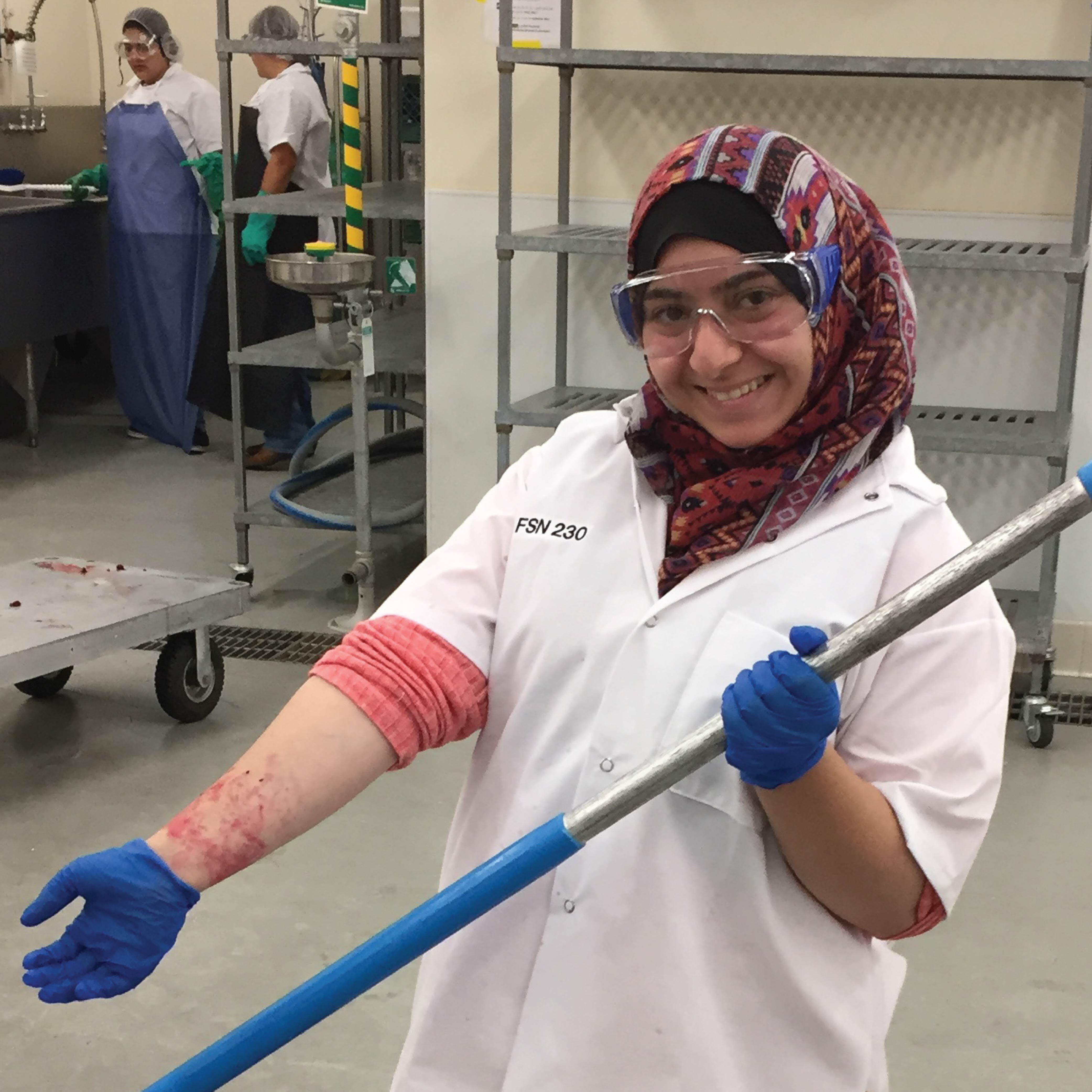 Cal Poly student employee working in the Food Science and Nutrition pilot plant